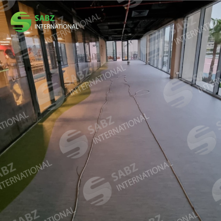 Vinyl flooring installation process in an office space, showcasing professional craftsmanship and attention to detail.